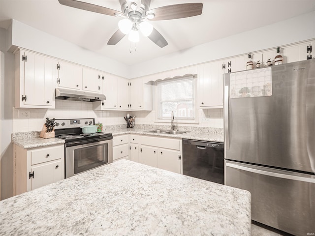 kitchen featuring white cabinets, sink, ceiling fan, appliances with stainless steel finishes, and tasteful backsplash