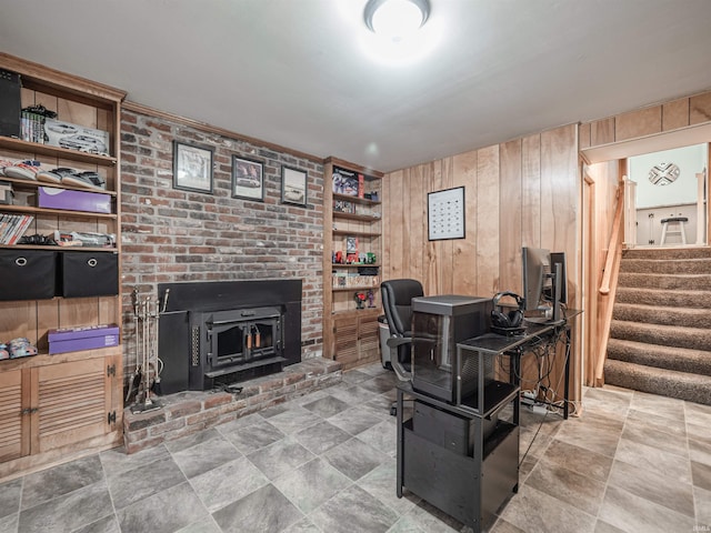 office space featuring built in features, a wood stove, and wooden walls