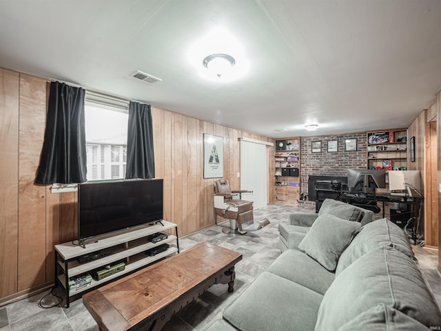 living room with wooden walls and brick wall