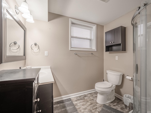 bathroom featuring hardwood / wood-style floors, vanity, and toilet