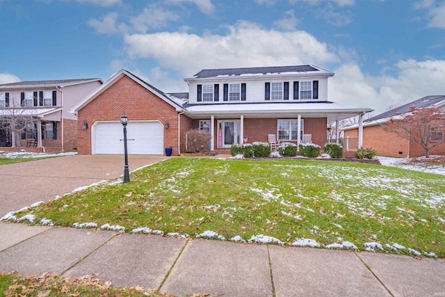 view of property with a front yard, a porch, and a garage