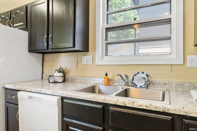 kitchen featuring dishwasher and sink