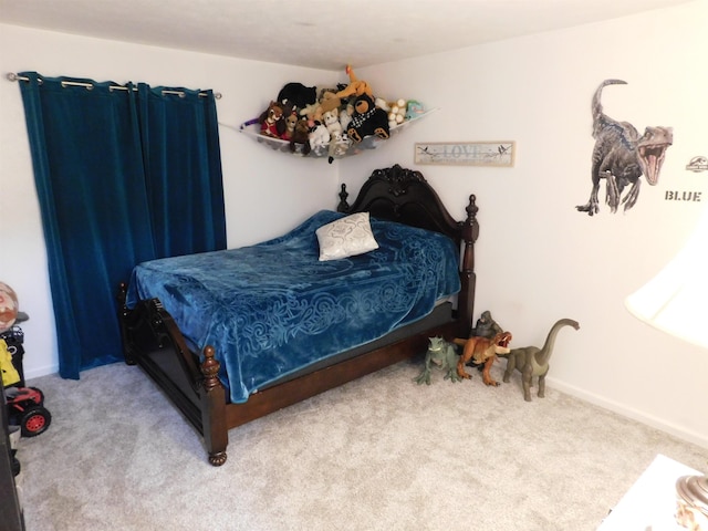 bedroom featuring light carpet