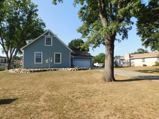 view of front facade with a front yard and a garage