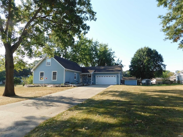 view of front facade with a garage and a front lawn