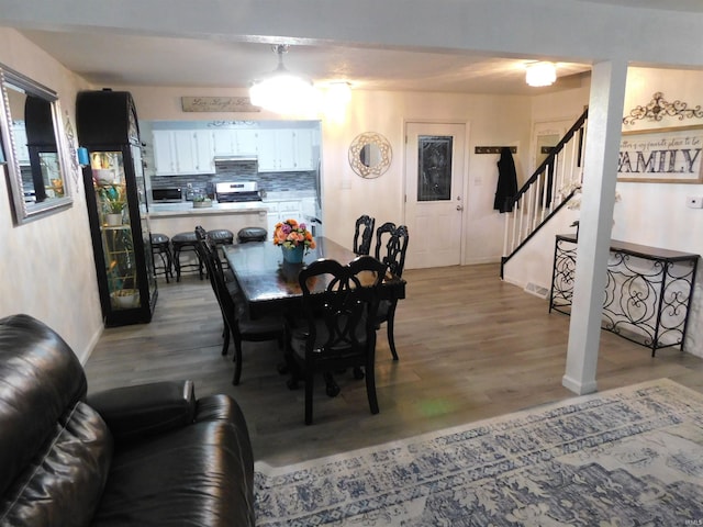 dining area featuring light wood-type flooring