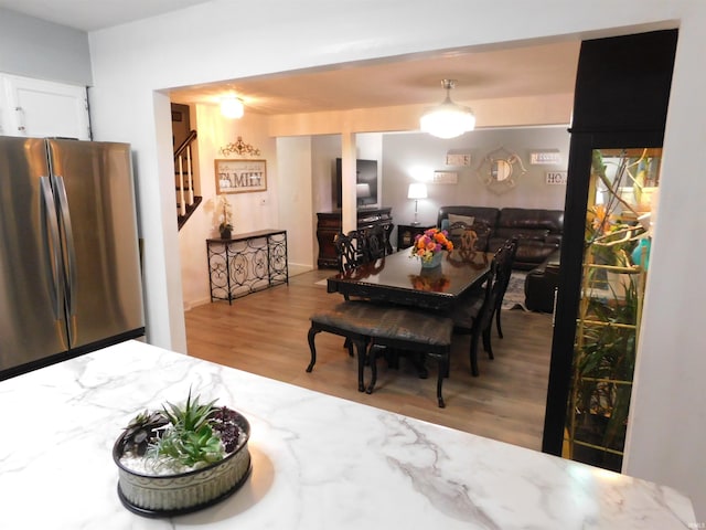 dining room with light hardwood / wood-style flooring