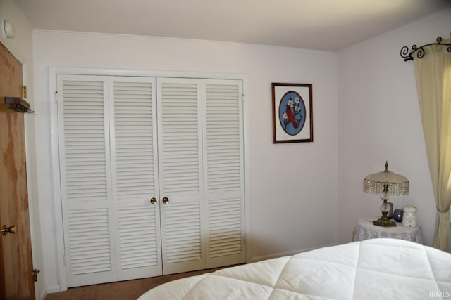 bedroom featuring a closet and ornamental molding