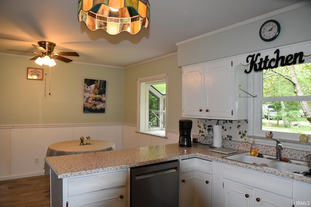 kitchen with white cabinetry, sink, ceiling fan, stainless steel dishwasher, and kitchen peninsula