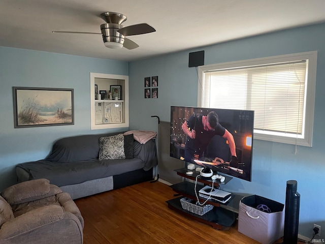 living room featuring ceiling fan and wood-type flooring