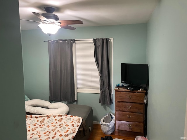 bedroom with hardwood / wood-style floors and ceiling fan