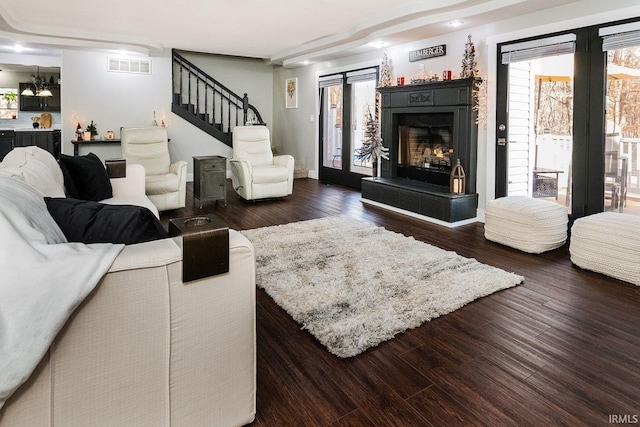 living room featuring dark wood-type flooring