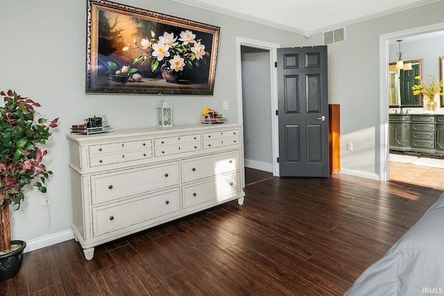 interior space with dark hardwood / wood-style flooring and ornamental molding