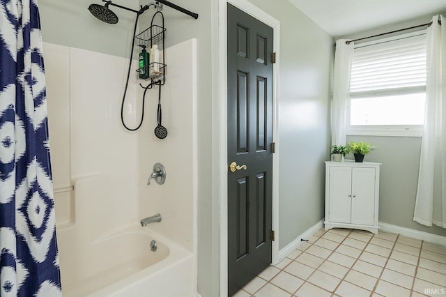 bathroom with tile patterned floors and shower / bath combo with shower curtain