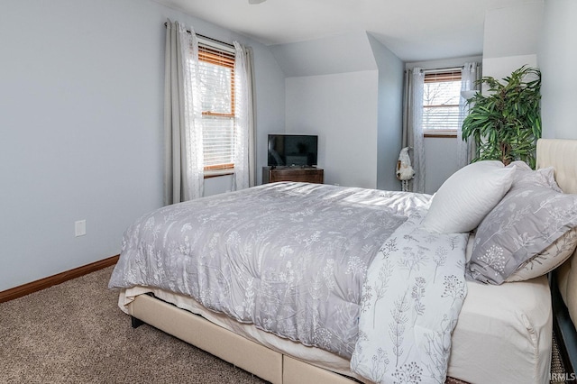 bedroom with carpet floors and vaulted ceiling