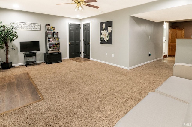 living room featuring carpet and ceiling fan