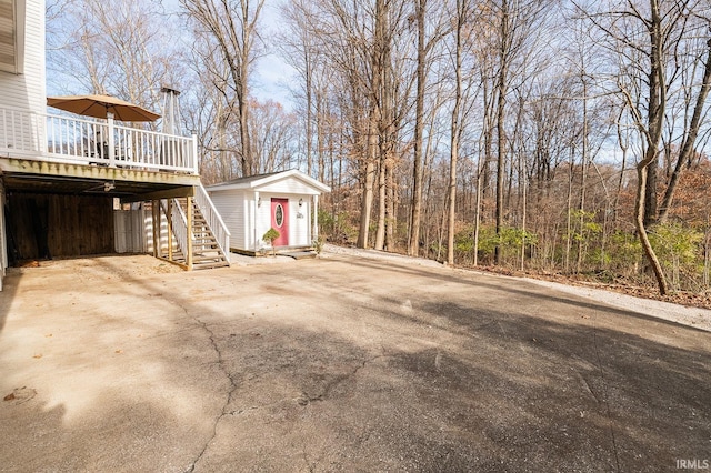 view of yard with an outbuilding and a deck