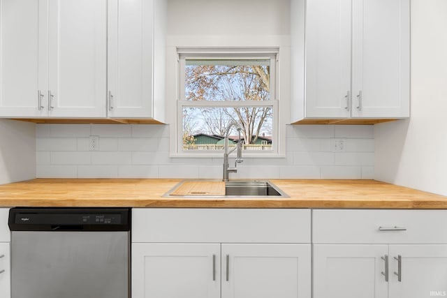 kitchen featuring white cabinets, backsplash, stainless steel dishwasher, and sink