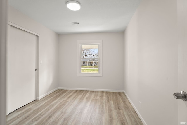 unfurnished room featuring light hardwood / wood-style floors