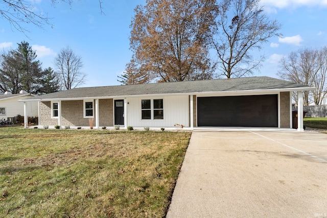 ranch-style house featuring a front yard and a garage