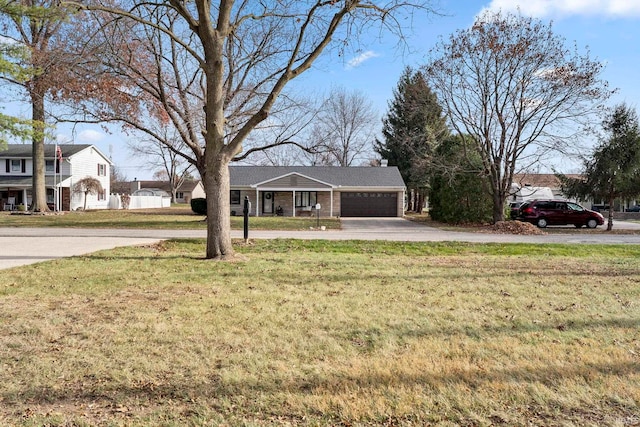 view of front facade with a garage and a front lawn