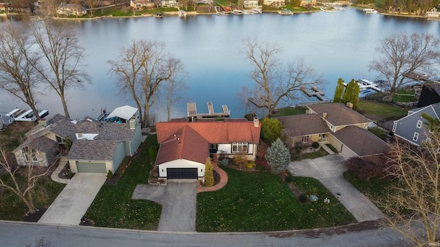 birds eye view of property with a water view