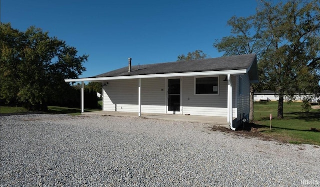 view of front facade with a carport