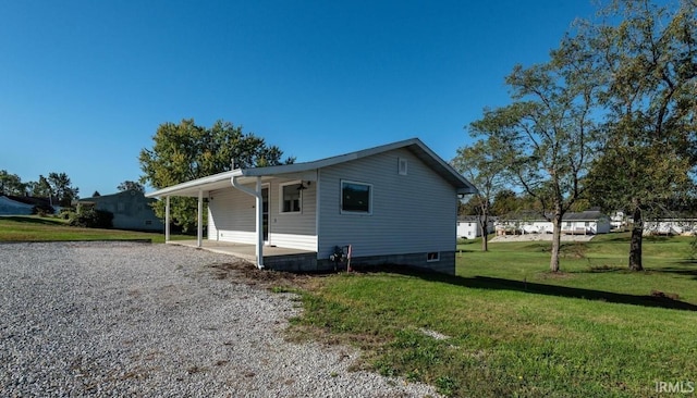 view of side of property with a yard