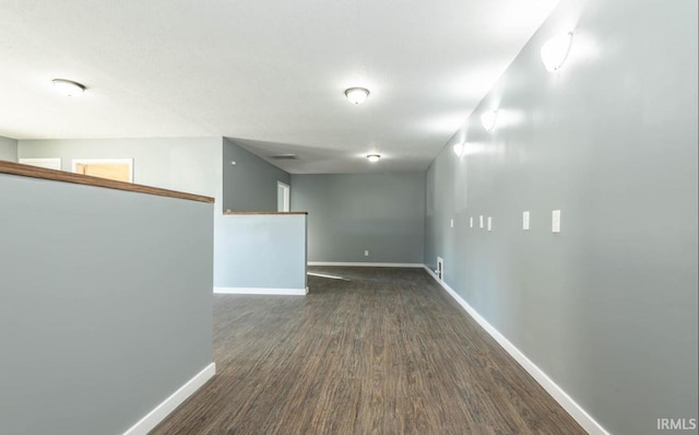 empty room featuring dark hardwood / wood-style flooring