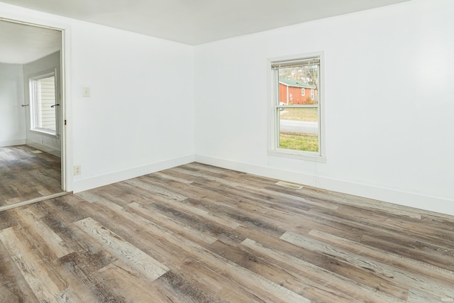 spare room featuring hardwood / wood-style floors