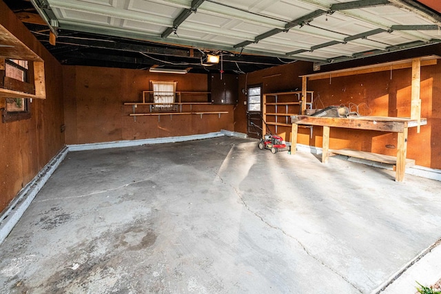 garage with wooden walls and a garage door opener