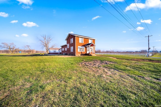 view of yard with a rural view