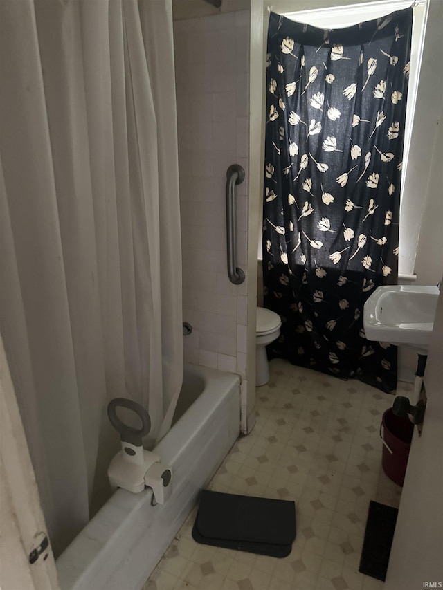 bathroom featuring tile patterned floors, toilet, and shower / tub combo with curtain