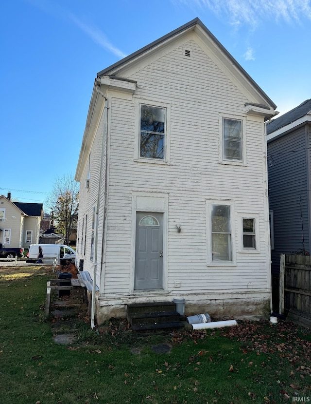 rear view of house with a lawn