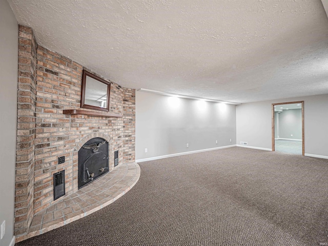 unfurnished living room with carpet flooring, a wood stove, and a textured ceiling