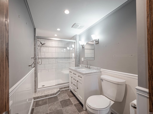 bathroom featuring vanity, toilet, walk in shower, and crown molding