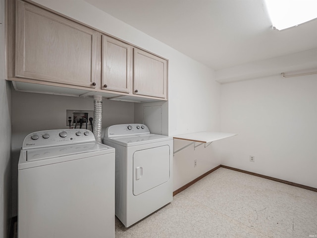 laundry area featuring cabinets and separate washer and dryer