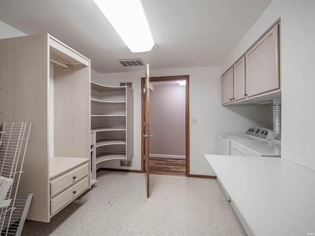 walk in closet featuring washer and dryer