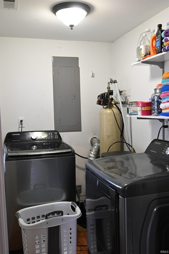 laundry room featuring washing machine and dryer and electric panel