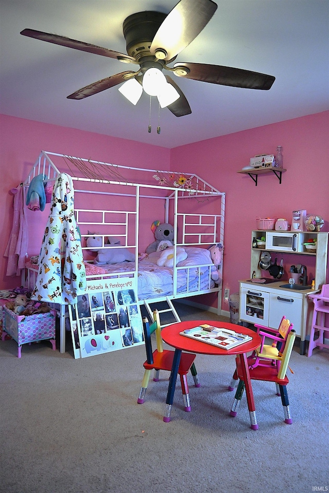 bedroom with ceiling fan and carpet