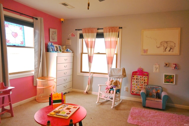 game room featuring light carpet