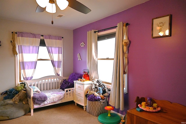 carpeted bedroom featuring ceiling fan