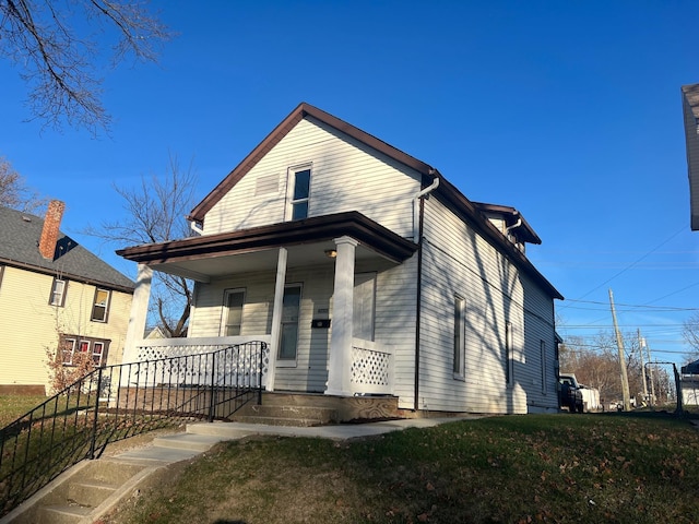 view of front facade with a porch and a front yard