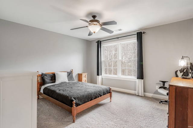 bedroom with light carpet and ceiling fan