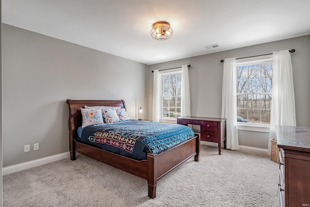 bedroom with light colored carpet