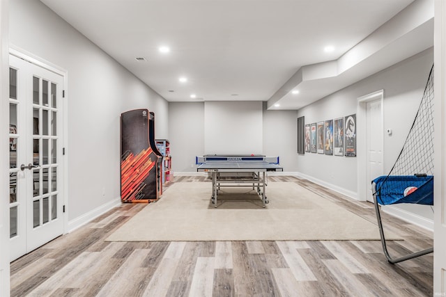 rec room with light wood-type flooring