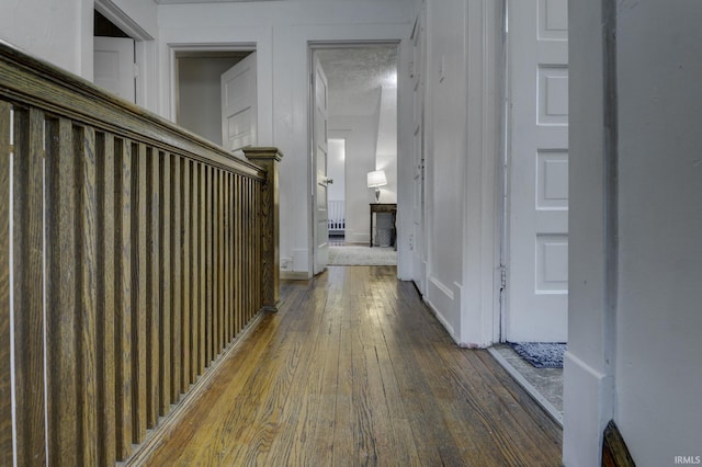 hall with dark wood-type flooring