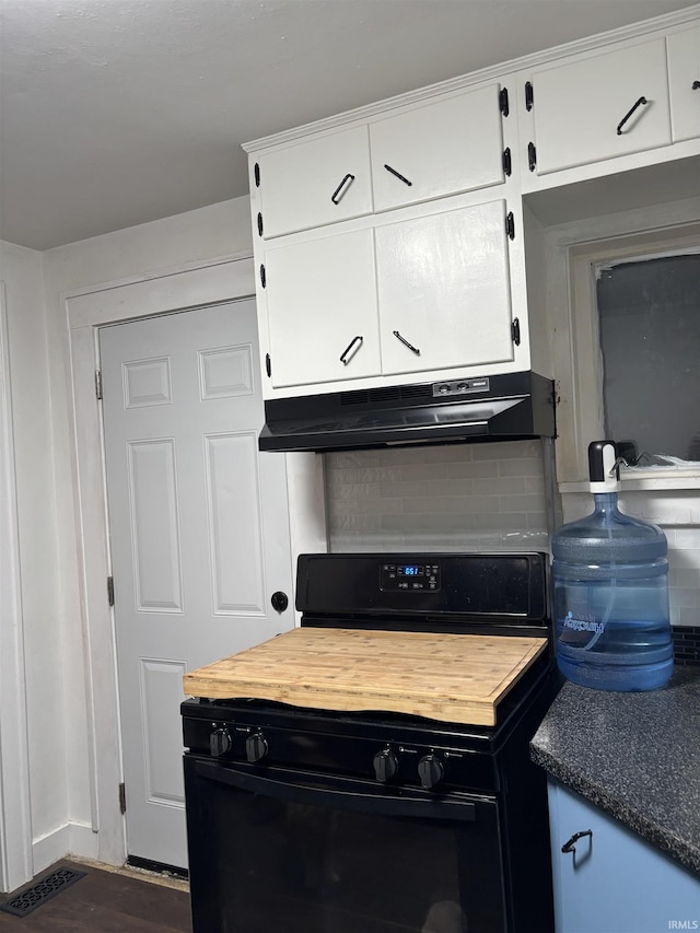 kitchen featuring decorative backsplash, white cabinetry, black range with gas cooktop, and dark wood-type flooring