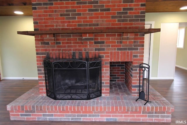 room details with hardwood / wood-style floors and a fireplace