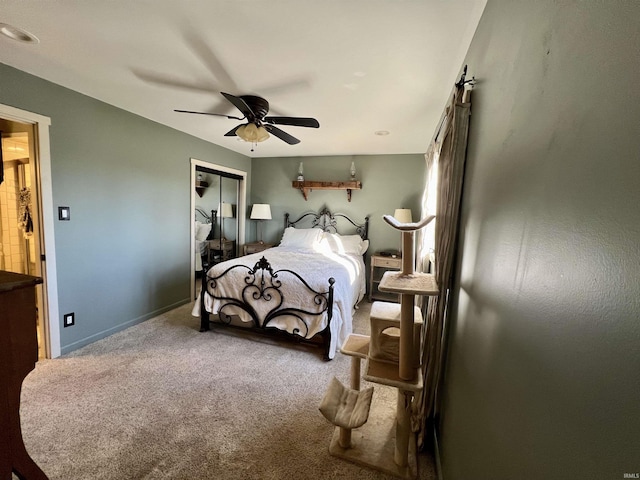 carpeted bedroom with a closet and ceiling fan